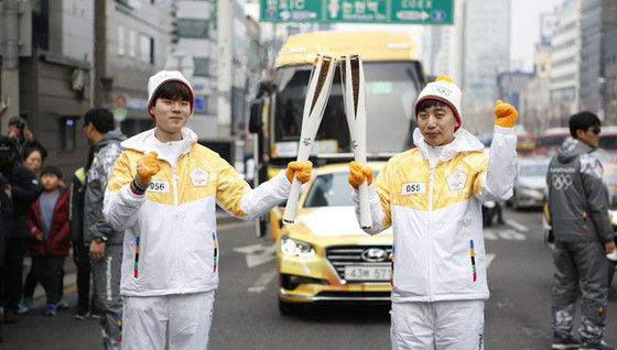 kt a participé au relais de la flamme olympique